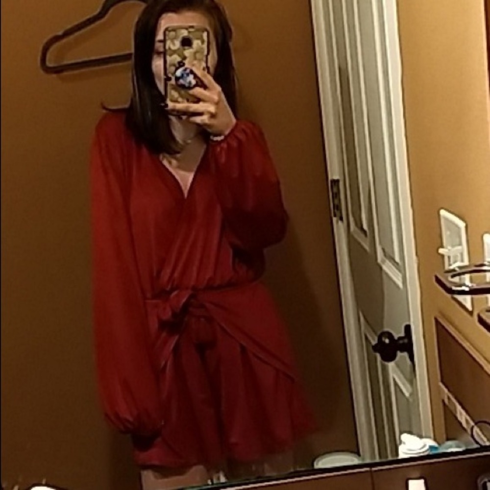 This is a super cute maroon colored romper.